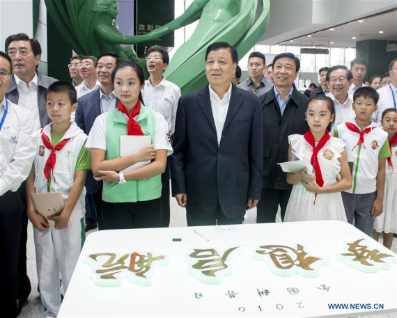 Liu Yunshan (front, 2nd R), a member of the Standing Committee of the Political Bureau of the Communist Party of China (CPC) Central Committee and the Secretariat of the CPC Central Committee, attends activities for National Science Popularization Day at China Science and Technology Museum in Beijing, capital of China, Sept. 18, 2016. (Xinhua/Wang Ye)