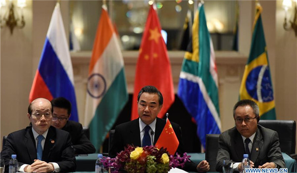 Chinese Foreign Minister Wang Yi (C) addresses a meeting of foreign ministers from the BRICS nations on the sidelines of a series of UN conferences in New York, the United States, on Sept. 20, 2016. Chinese Foreign Minister Wang Yi on Tuesday urged the BRICS nations to preserve world peace and help promote global growth. (Xinhua/Yin Bogu)