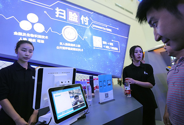 A Chinese internet company displays its face identification technology, which increases security for online payments, at Cybersecurity Week in Wuhan.Cheng Hui / Xinhua
