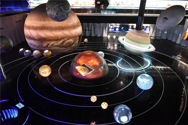 A model of the solar system is displayed at FAST, China's Single-Aperture Spherical telescope, in Pingtang county, Guizhou province, Sept 24, 2016. (Photo/Xinhua)