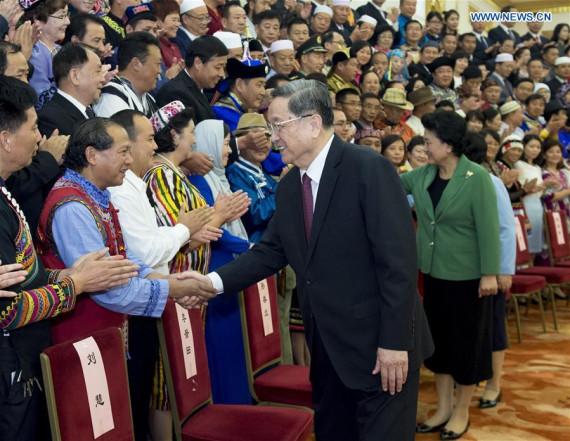 Yu Zhengsheng (R, front), chairman of the National Committee of the Chinese People's Political Consultative Conference, meets with a delegation of Chinese ethnic minorities in Beijing, capital of China, Sept. 28, 2016. (Photo: Xinhua/Wang Ye)