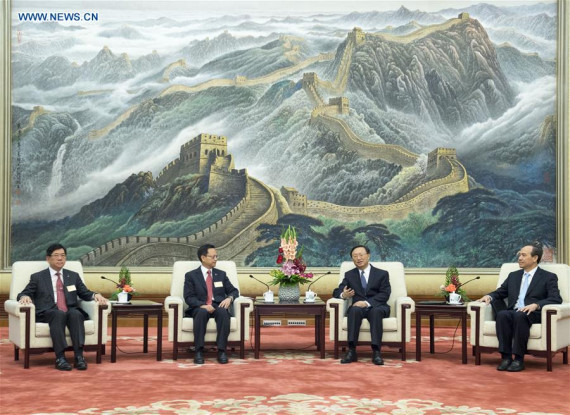 Chinese State Councilor Yang Jiechi (2nd R) meets with a delegation of the Hong Kong Professionals and Senior Executives Association, which is led by its president Chan Siu Hung, at the Great Hall of the People in Beijing, capital of China, Sept. 28, 2016. (Photo: Xinhua/Wang Ye)