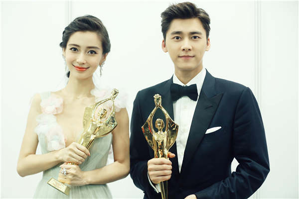 Li Yifeng and Yang Ying win the Hundred Flowers Awards' best supporting actor and actress. (Photo provided to China Daily)