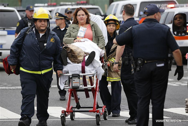 A victim is wheeled on a stretcher out of the Hoboken station following a train crash in New Jersey, the United States on Sept. 29, 2016. One person was confirmed killed and 108 others injured after a transit train crashed into New Jersey's Hoboken station during the morning rush hour Thursday. (Xinhua/Gary Hershorn)