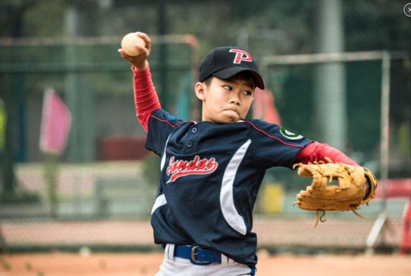 Central outfielder Liang Tingxi of Xuri Middle School in Dongsheng, Zhongshan City, 12, has been playing baseball since third grade, and is now a frequent participant in the national 1A competition as a pivotal player on Team Pandas. (Photo provided to China Daily)