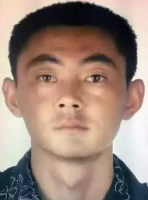 Li Xuyi, security truck robbery suspect.