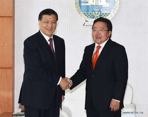 Liu Yunshan (L), a member of the Standing Committee of the Political Bureau of the Communist Party of China (CPC) Central Committee, meets with Mongolian President Tsakhiagiin Elbegdorj in Ulan Bator, Mongolia, Oct. 1, 2016. (Xinhua/Rao Aimin)