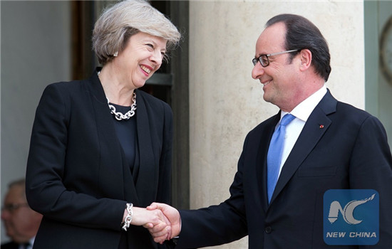 French President Francois Hollande(R) shakes hands with British Prime Minister Theresa May during their meeting at the Elysee Palace in Paris, France on July 21, 2016. (Xinhua/Alan Wilson) 