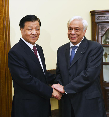 Liu Yunshan (L), a member of the Standing Committee of the Political Bureau of the Central Committee of the Communist Party of China, meets with Greek President Prokopis Pavlopoulos in Athens, Greece, Oct. 4, 2016. (Photo: Xinhua/Rao Aimin)