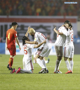 Syria's players celebrate after winning in a match between China and Syria of 2018 FIFA World Cup Russia Qualifiers in Xi'an, capital of northwest China's Shaanxi Province, Oct. 6, 2016. Syria won 1-0. (Xinhua/Ding Xu)