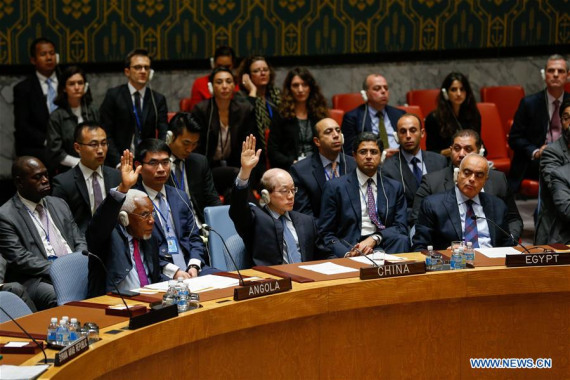 Liu Jieyi(C, front), Chinese Permanent Representative to the United Nations, votes to abstain a France-drafted UN Security Council resolution on Syria at the United Nations headquarters in New York, Oct. 8, 2016. (Photo: Xinhua/Li Muzi)