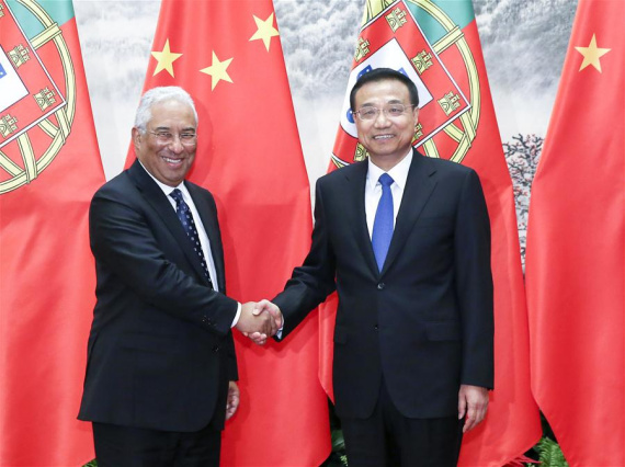 Chinese Premier Li Keqiang (R) shakes hands with Portuguese Prime Minister Antonio Costa in Beijing, capital of China, Oct. 9, 2016. (Photo: Xinhua/Pang Xinglei)