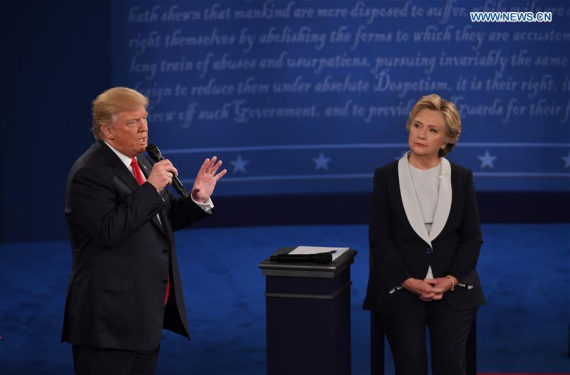 Republican presidential candidate Donald Trump (L) and Democratic presidential candidate Hillary Clinton participate in the second presidential debate at Washington University in St. Louis, the United States, on Oct. 9, 2016. (Photo: Xinhua/Yin Bogu)