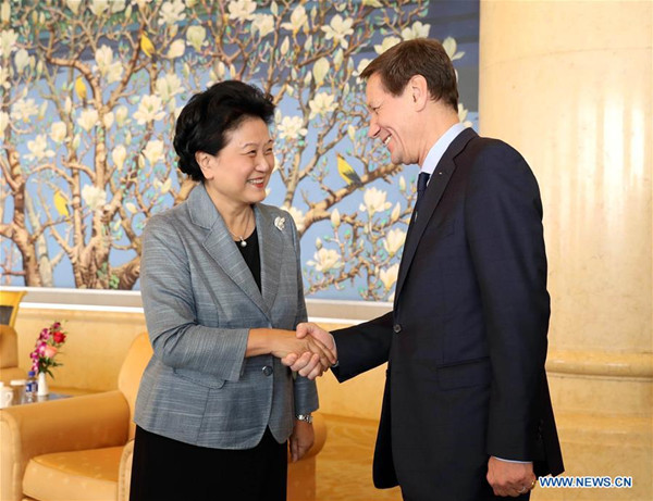 Chinese Vice Premier Liu Yandong (L) meets with head of the International Olympic Committee (IOC)'s coordination commission for the 2022 Winter Games Alexander Zhukov in Beijing, capital of China, Oct. 10, 2016. (Xinhua/Meng Yongmin)