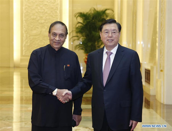 Zhang Dejiang (R), chairman of the Standing Committee of the National People's Congress (NPC), holds talks with the Speaker of the Sri Lankan parliament Karu Jayasuriya in Beijing, capital of China, Oct. 14, 2016. (Xinhua/Ju Peng) 