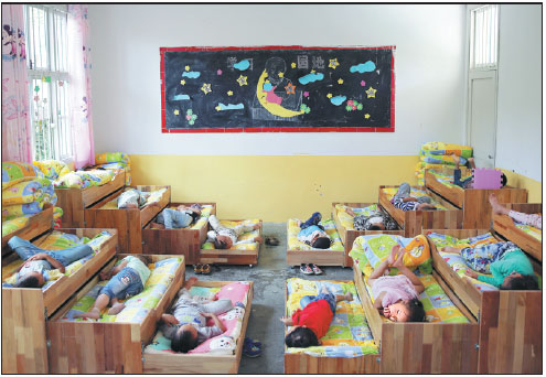 Children take a post-lunch nap at the Muziping Village Kindergarten in Tongren.(Photos By Hou Liqiang / China Daily)