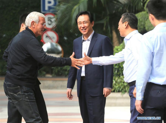 Italian soccer coach Marcello Lippi (L) shakes hands with Cai Zhenhua, president of China Football Association (CFA), in Guangzhou, capital of south China's Guangdong Province, Oct. 22, 2016. Marcello Lippi will be the head coach of Chinese men's soccer team from Oct. 22, 2016, according to the official website of the CFA. (Photo: Xinhua)