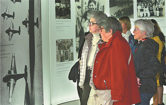Visitors tour an exhibition about the Nanjing Massacre, in which 300,000 died in 1937, at the Memorial de Caen museum in France. (LONG JIANWU / CHINA NEWS AGENCY)