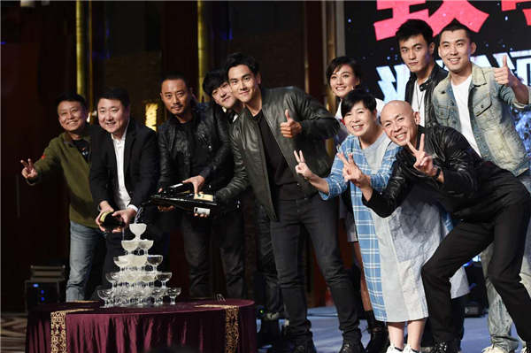 Zhang Hanyu (third from left), Eddie Peng (center) and the director Dante Lam (right) celebrate Operation Mekong's soaring box office. (Photo provided to China Daily)