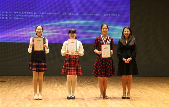 Former short track speed skater, Olympics gold medalist Yang Yang (right) pose with the three champions (from left) Huang Sihan, Zhao Nan and Fu Zhijun of the English speech contest after the final was held over the weekend.