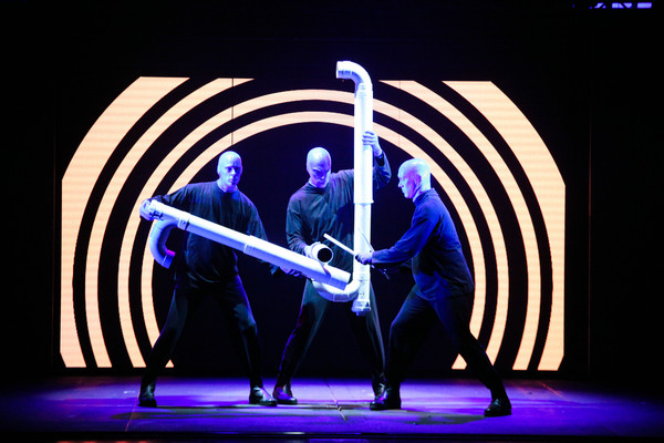 Three blue men drum on PVC tubes during the dressed rehearsal for Blue Man Group's debut show in the Guangzhou Opera House. (Photo provided to China Daily)