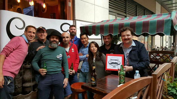 Maovember raises cash for disadvantaged families with bar games, donations, pin sales, wine tastings and more. (Photo provided to China Daily)