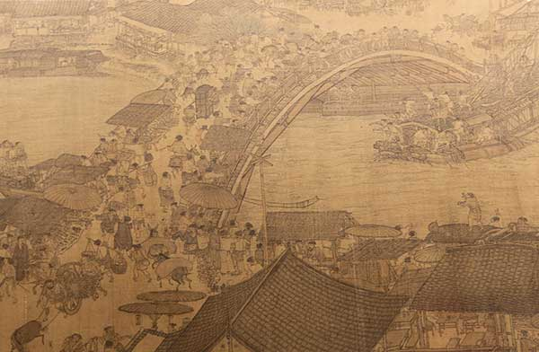 A copy of Along the River During the Qingming Festival by Ming Dynasty painter Qiu Ying portrays city life of ancient Suzhou. (Photo by Jiang Dong/Wang Kaihao/China Daily)