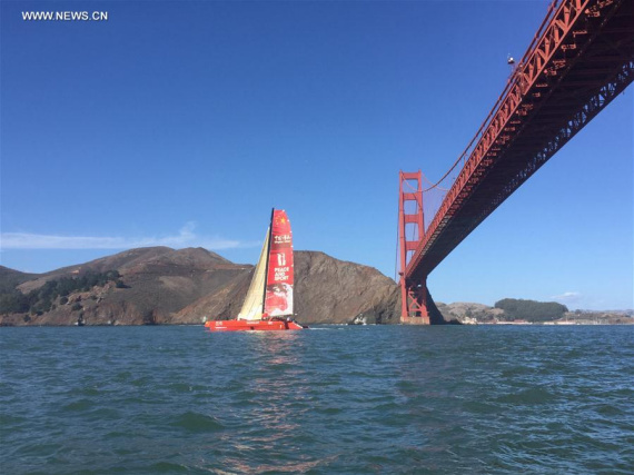 Chinese mariner Guo Chuan sails his trimaran under San Francisco's Golden Gate Bridge, the United States, embarking on a solo trans-Pacific voyage with Shanghai, China, as the destination, Oct. 18, 2016. (Photo/Xinhua)
