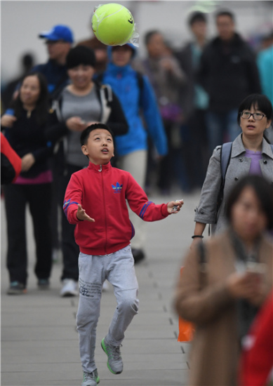 A boy at the China Open in Beijing on Friday. (Photo by WEI XIAOHAO/CHINA DAILY)