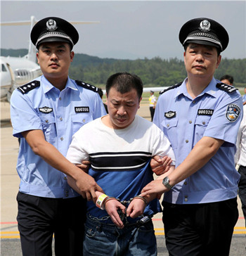 Yang Jinjun, former general manager of Minghe Group in Wenzhou, Zhejiang province, was repatriated in September last year. Yang was the first of the 100 most-wanted fugitives repatriated from the U.S. (Photo/Xinhua)