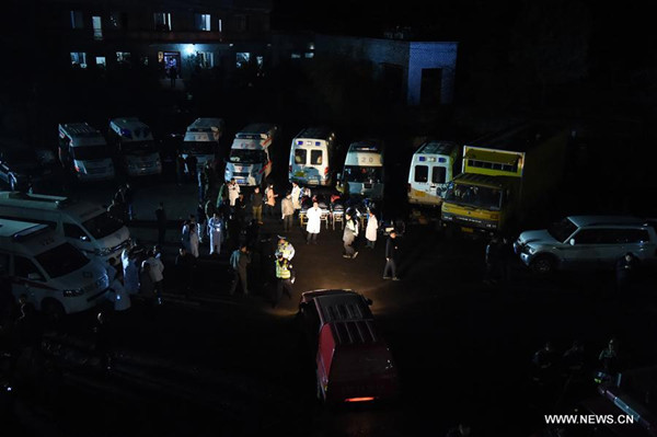 Rescuers work at Jinshangou Coal Mine in Laisu Town of Yongchuan District in Chongqing, southwest China, Oct. 31, 2016. 33 miners were trapped underground after a gas explosion which occurred at 11:30 a.m. at the coal mine when 35 miners were working in the shaft. Two were hoisted to safety. Rescuers are searching for those trapped underground. (Xinhua/Tang Yi)