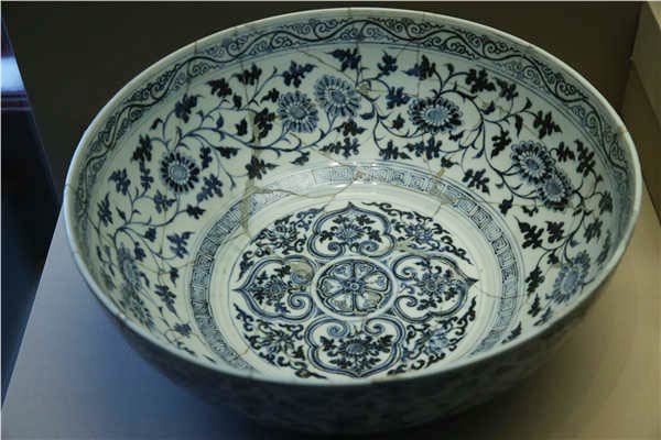 Visitors look at the ongoing exhibitions that showcase ceramics made in China's porcelain hub, Jingdezhen, for imperial courts during the Ming and Qing dynasties at the Palace Museum in Beijing. The imperial-kiln ceramics represent a zenith in the country's porcelain-making history.