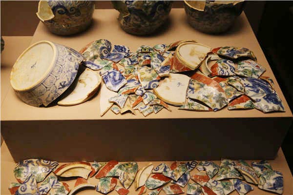 Visitors look at the ongoing exhibitions that showcase ceramics made in China's porcelain hub, Jingdezhen, for imperial courts during the Ming and Qing dynasties at the Palace Museum in Beijing. The imperial-kiln ceramics represent a zenith in the country's porcelain-making history.