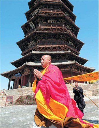 Sakyamuni Wooden Pagoda, also named Yingxian Wooden Pagoda and built around 1056, is renowned for its unparalleled architecture and precious relics. The unique wooden structure attracts believers from all over China.(Fan Minda / Xinhua)