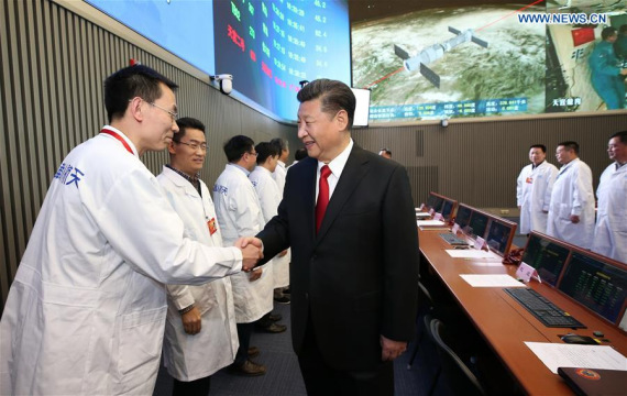 Chinese President Xi Jinping shakes hands with staff members at the command center of China's manned space program in Beijing, capital of China, Nov. 9, 2016. Xi Jinping on Wednesday talked with the two astronauts in the space lab Tiangong-2, at the command center of China's manned space program. (Xinhua/Ma Zhancheng)