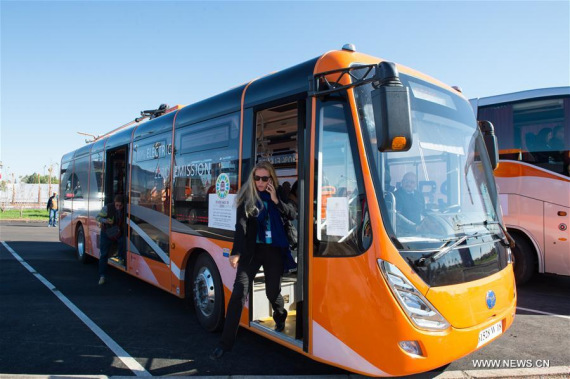 Passengers get off an electric bus from China in Marrakech, Morocco, Nov. 9, 2016. Over ten electric buses from China served the delegates during the 22nd Conference of Parties to the United Nations Framework Convention on Climate Change (COP22) in Marrakech. (Photo: Xinhua/Meng Tao)