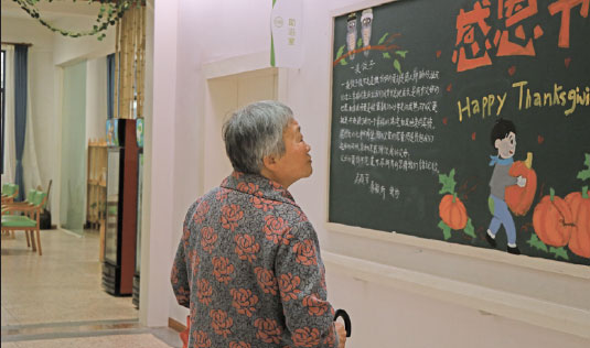 Qiu Xinying, 73, enjoys her life at Wuzhen Chunxitang Seniors Service Center. (Photo/China Daily)