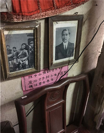 Old photos of a man getting his long ponytail cut and a portrait of Sun Yat-sen in Yang Yuefu's carpentry shop.