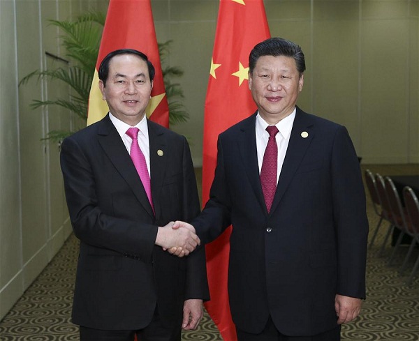 Chinese President Xi Jinping (R) meets with Vietnamese President Tran Dai Quang in Lima, Peru, Nov. 19, 2016. (Xinhua/Pang Xinglei)