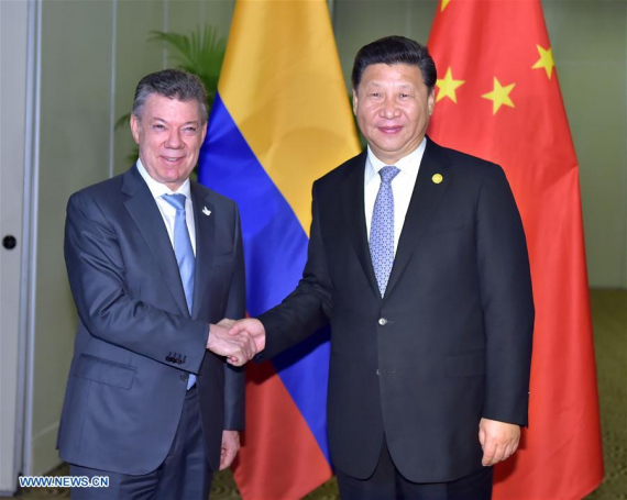 Chinese PresidentXi Jinping(R) meets with his Colombian counterpart Juan Manuel Santos in Lima, Peru, Nov. 19, 2016. (Photo：Xinhua/Li Tao)