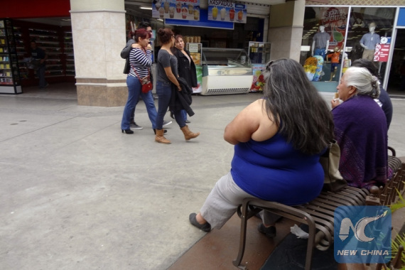 Image taken on May 6, 2015 shows an overweight woman in a mall in Tijuana City, northeast of Mexico. (Photo/Xinhua)