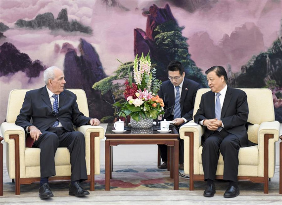 Liu Yunshan (R), a member of the Standing Committee of the Political Bureau of the Communist Party of China Central Committee, meets with a Communist Party of Cuba (PCC) delegation led by Abelardo Alvarez Gila, a member of the Secretariat of the PCC Central Committee, in Beijing, capital of China, Nov. 28, 2016. (Photo: Xinhua/Li Xueren)