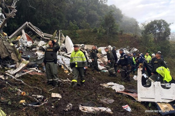Image provided by Noticias Telemedellin shows rescuers inspecting the site of the crashed plane carrying the Brazilian soccer team Chapecoense, in La Ceja municipality, near Medellin, in the department of Antioquia, Colombia, on Nov. 29, 2016. (Xinhua/Noticias Telemedellin)