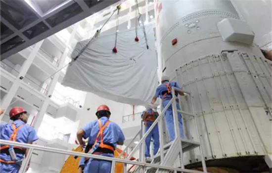 An undated photo shows technicans work on the heavy-lift carrier rocket Long March 5. (Photo/Xinhua)