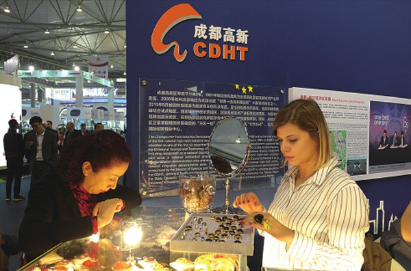 Visitors browse products at the pavilion of the European Union, a highlight during the fair. (Photo/China Daily)
