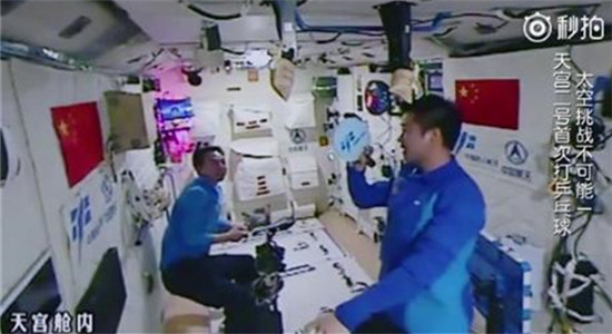 Screenshot of astronaut Chen Dong returning the ball aboard the Tiangong-2 space lab.