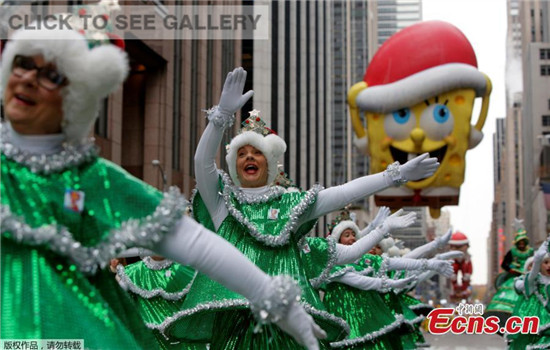 The Tap Dancing Christmas Trees perform on 6th Avenue during the 90th Macy's Thanksgiving Day Parade in Manhattan, New York, U.S., November 24, 2016. (Photo/Agencies)