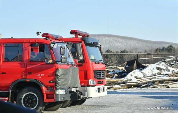 Photo taken on Dec. 2, 2016 shows fire engines at the accident site after a private coal mine blast in Qitaihe City, northeast China's Heilongjiang Province. Twenty-one people had been confirmed dead and one was still trapped in the explosion accident which occurred on Nov. 29. (Xinhua/Wang Song)