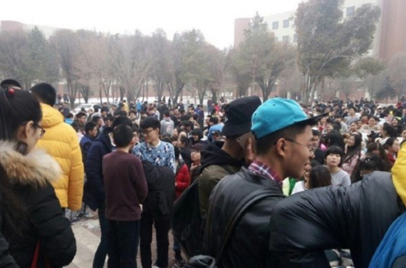 People gather at outdoor ground after a 6.2-magnitude earthquake jolted Hutubi County in Hui Autonomous Prefecture of Changji, Xinjiang Uygur Autonomous Region, at 1:15 p.m., Dec. 8, 2016. (Photo/Weibo)