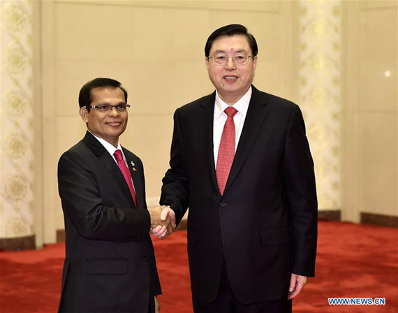 Zhang Dejiang (R), chairman of the Standing Committee of China's National People's Congress (NPC), holds talks with Abdulla Maseeh Mohamed, speaker of the People's Majlis, the legislative body of the Maldives, in Beijing, capital of China, Dec. 7, 2016. (Photo: Xinhua/Li Tao)